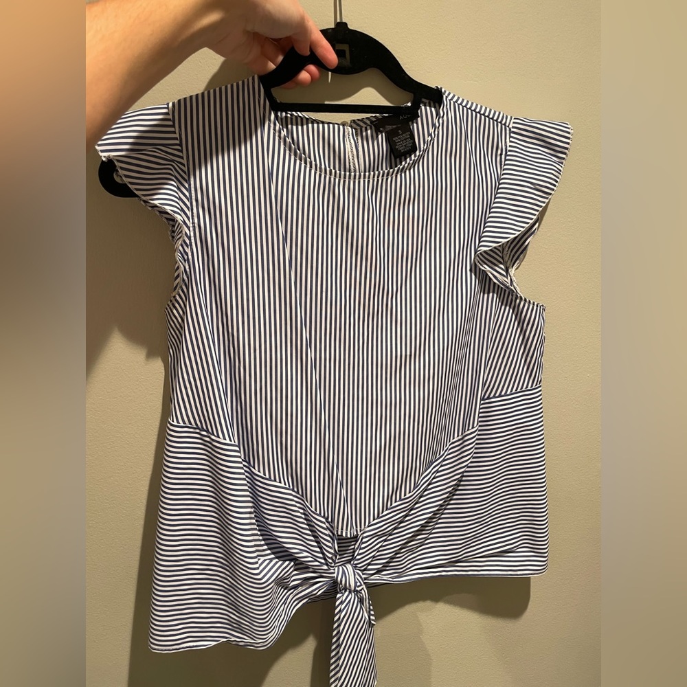 Aqua brad top with ruffled shoulder and blue and white stripes